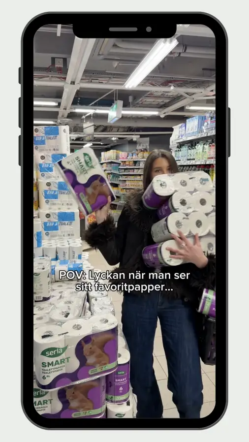 Melina handlar toalettpapper i butik